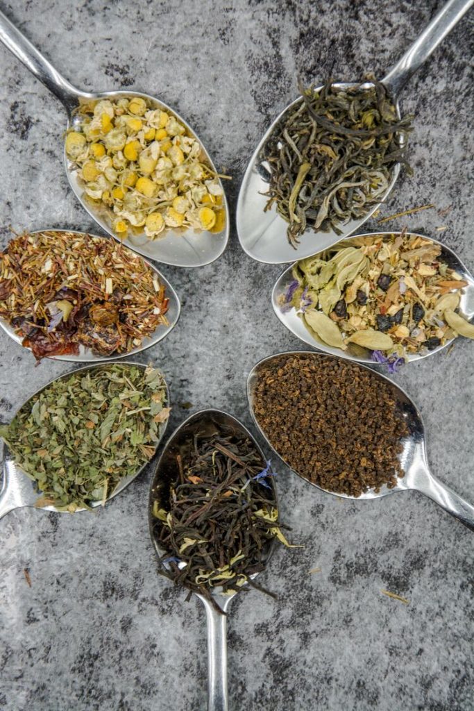 Variety of tea, leaves, flowers and fruits