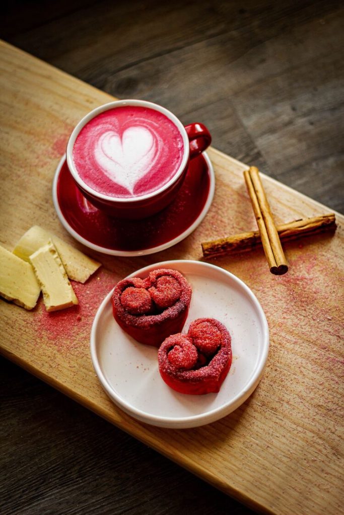 Red velvet latte and heart shaped pastries